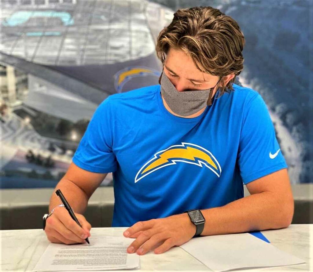 Justin Herbert signing contract with Los Angeles Chargers