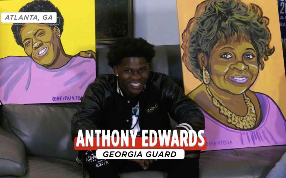 Anthony Edwards showing painting of his late mother and grandmother